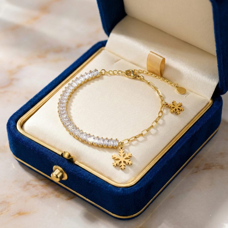 An elegant gold bracelet made of rust-resistant stainless steel, combining the sparkle of shiny zircon stones and delicate snowflake pendants, with an adjustable clasp to fit you. - Image 3